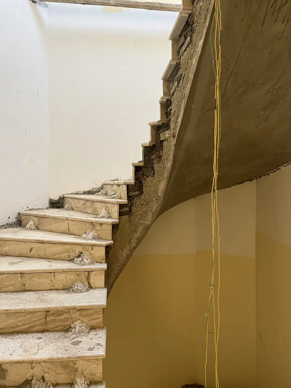 Before: concrete staircase during works