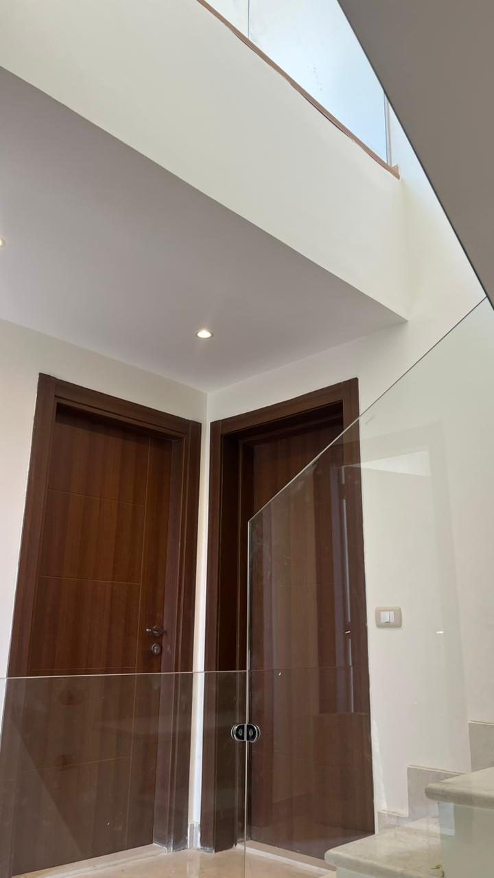 Timber entrance doors and glass balustrade