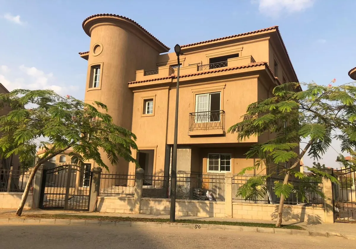After: finished villa facade with tiled roofs