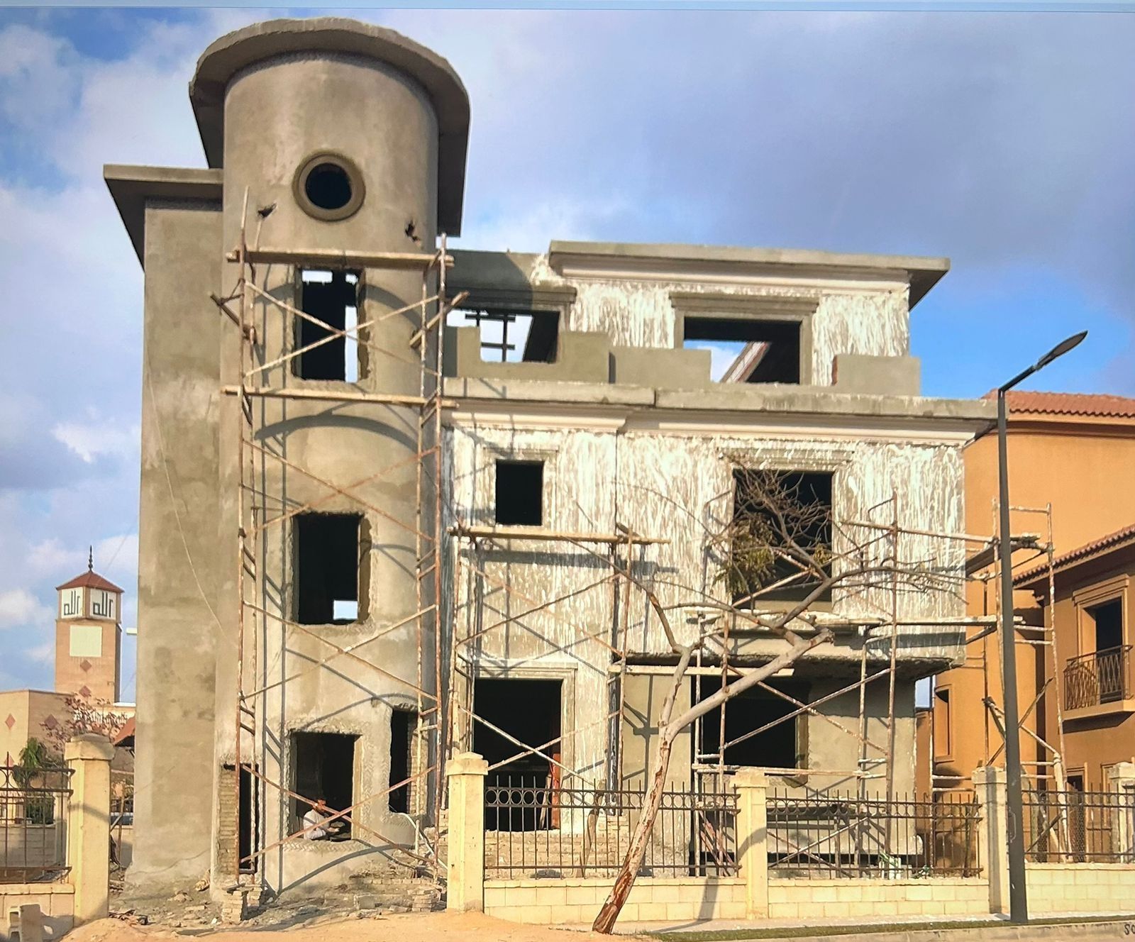 Construction stage: masonry and render with scaffolding